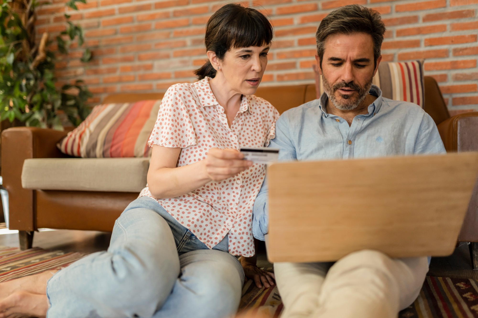 mature couple, family, Caucasian mature, adult and retiree using laptop with credit card,